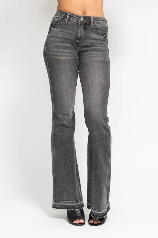 Washed gray mid-rise flare jeans with frayed release hem and back yoke seams