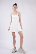 White tennis mini dress with spaghetti straps and built-in inner shorts