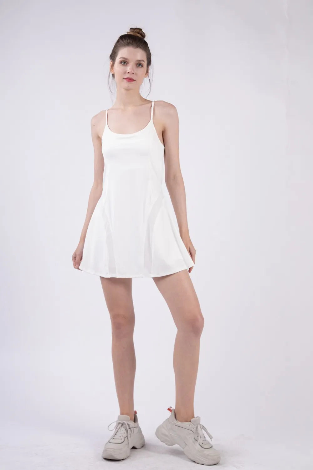 White tennis mini dress with spaghetti straps and built-in inner shorts