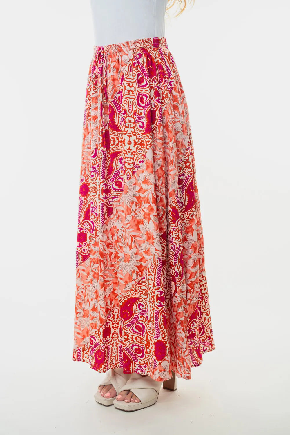 Orange floral woven maxi skirt with ornate paisley print, gathered high waist