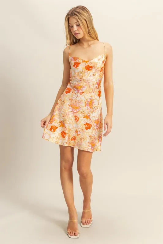 Orange floral satin mini dress with cowl neckline and thin straps, flirty A-line skirt