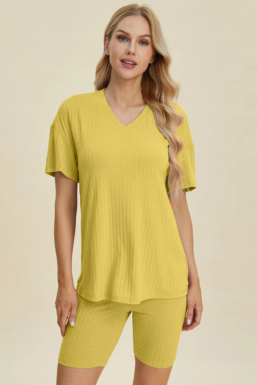 Yellow ribbed V-neck short sleeve top and matching biker shorts set, front view