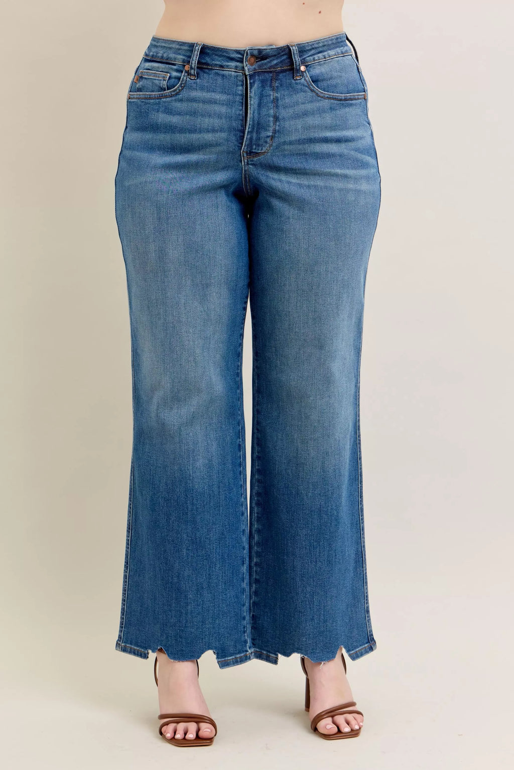 High-waist wide-leg jeans in medium blue wash with button and zipper closure