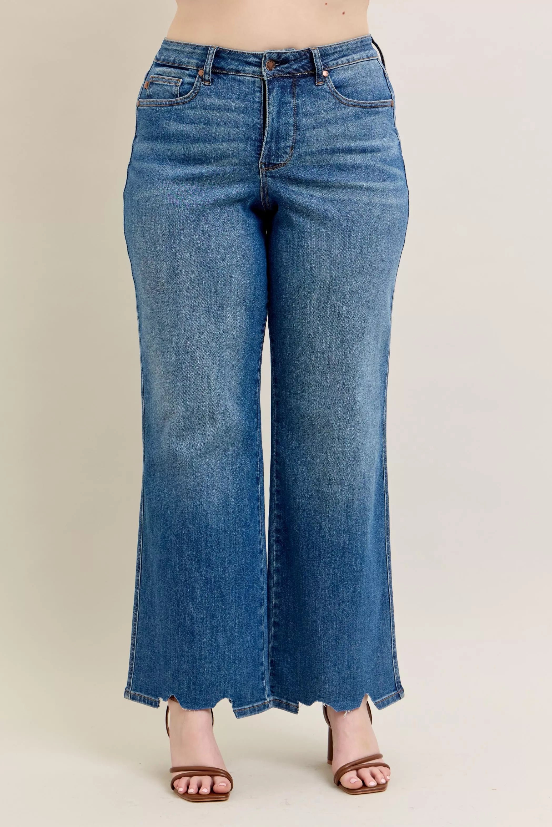 High-waist wide-leg jeans in medium blue wash with button and zipper closure