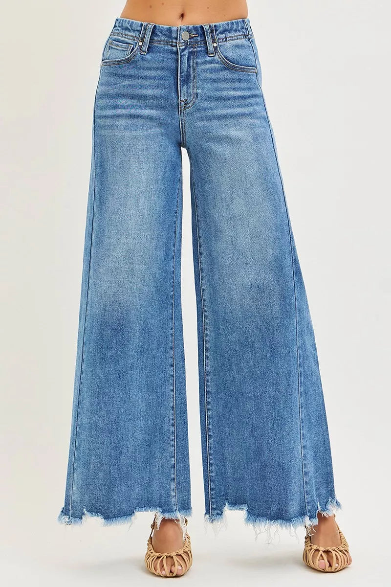 High-rise ankle wide-leg jeans in medium wash with five-pocket styling and frayed hem