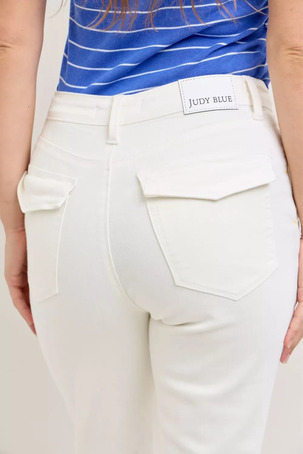 Close-up of white Judy Blue high-waist jeans with patch pockets