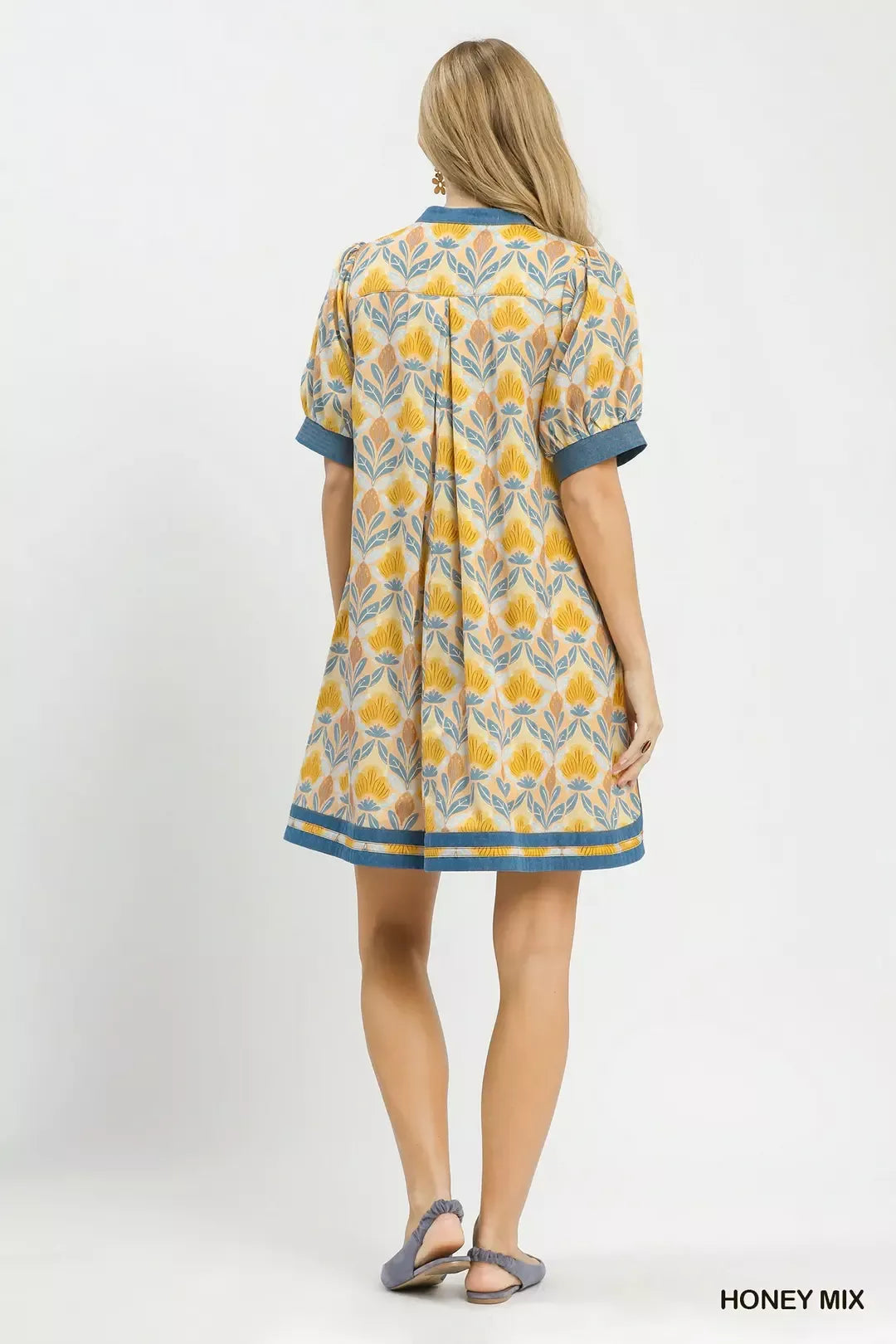 Back view of Honey mix mini dress with short sleeves and blue hem border