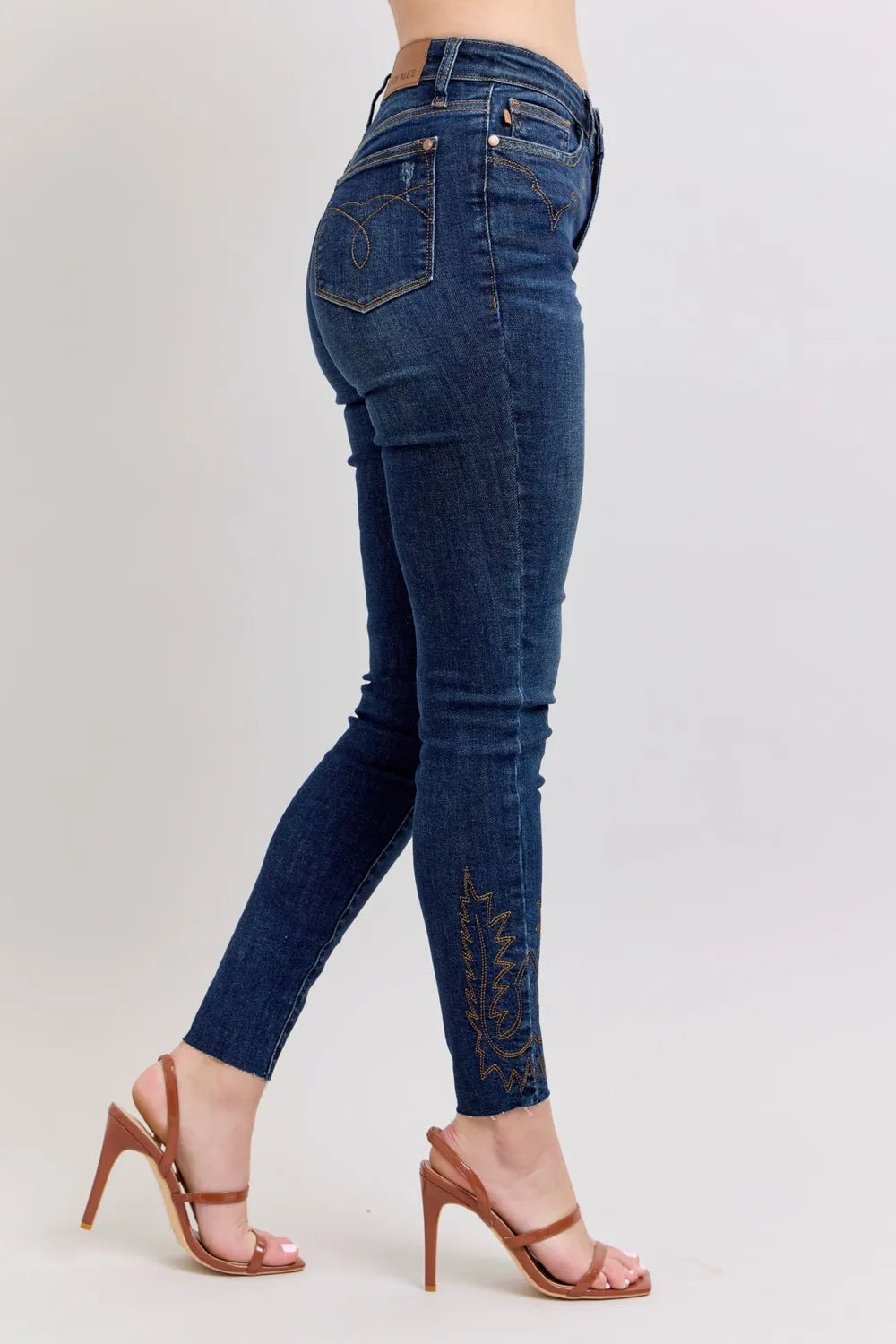 Dark blue high-rise skinny jeans with embroidered side leg on plus size