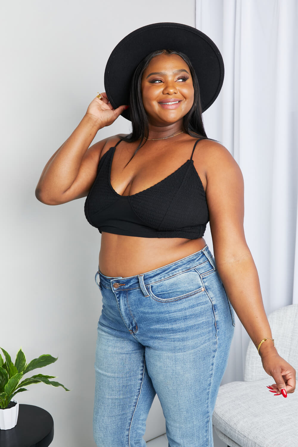Black textured spaghetti strap bralette with deep V neckline and curved underband