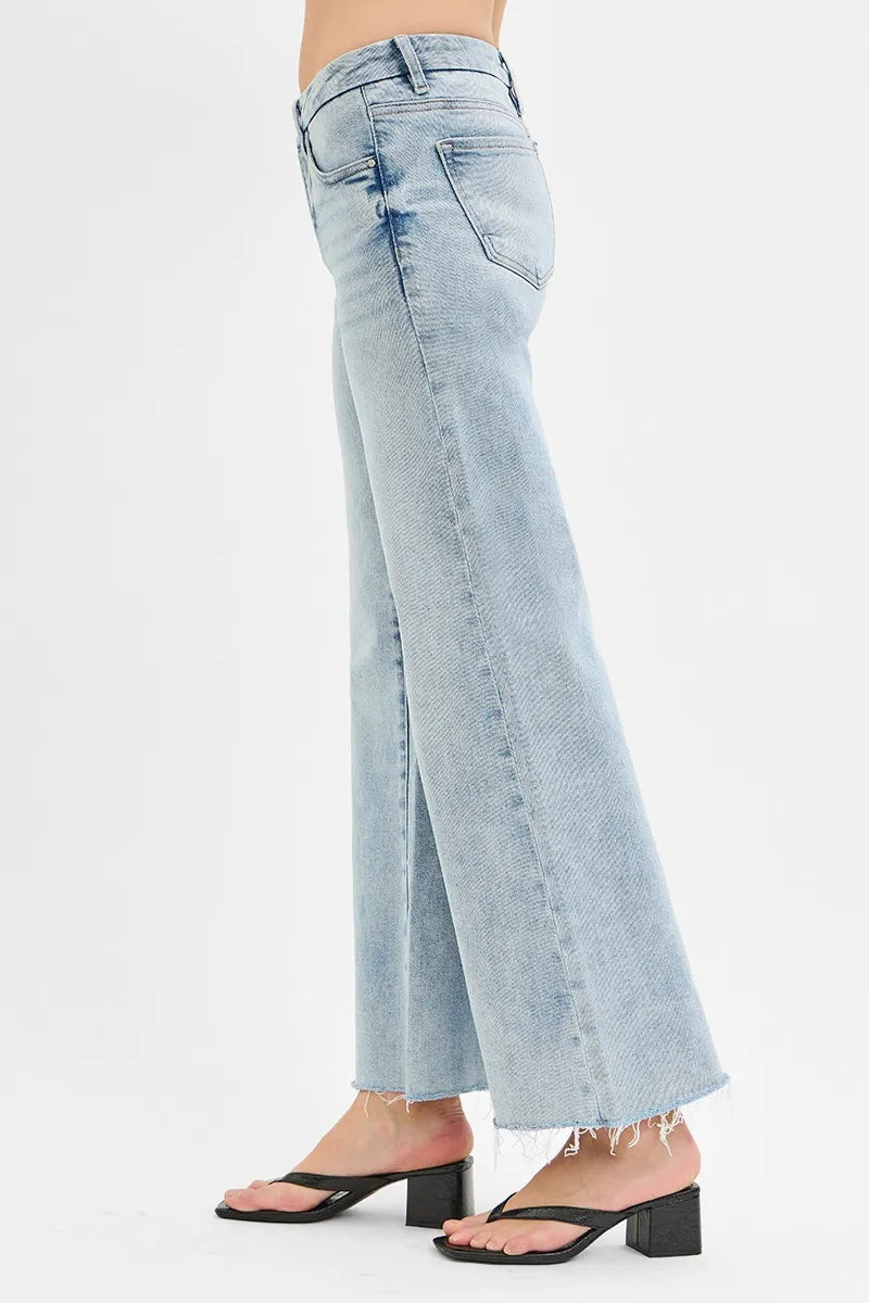 Light-wash wide-leg jeans, low rise, back pockets, raw frayed hem