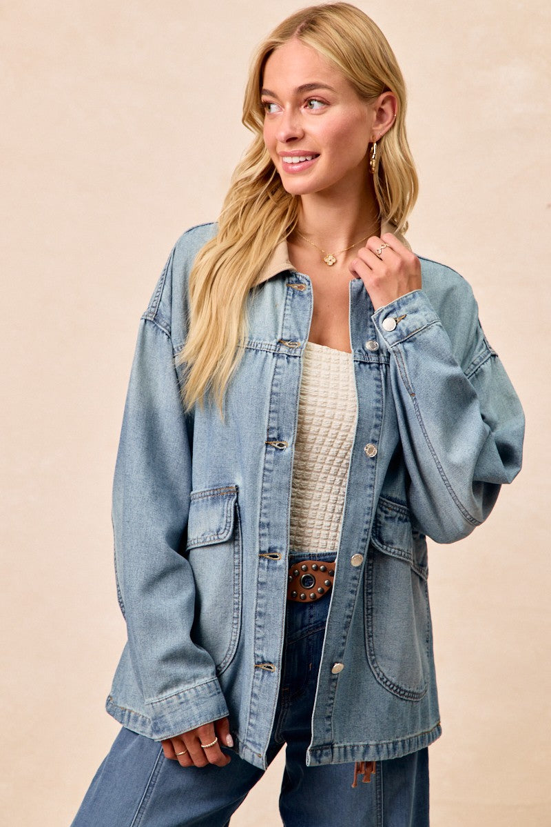 Washed denim jacket with contrast tan collar, button front, and two chest pockets
