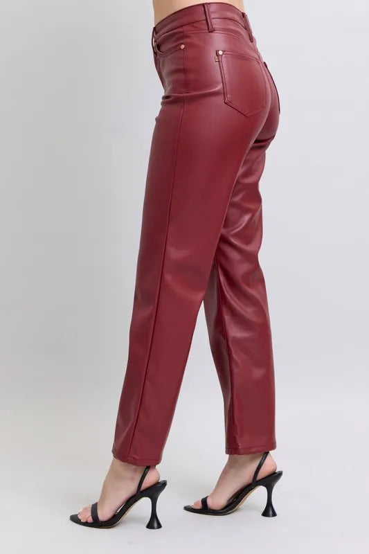 Red high-waist faux leather straight pants, back view with yoke seam and pockets