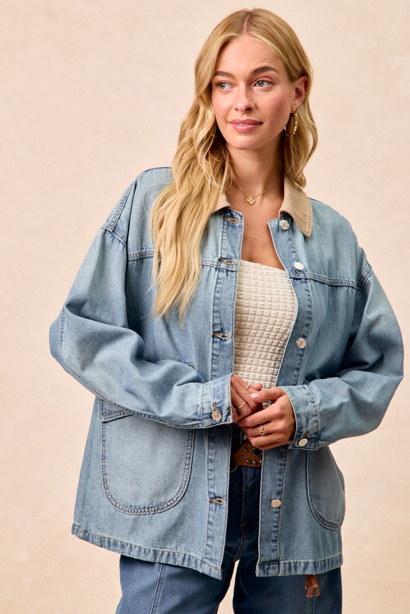 Front view of washed denim jacket with contrast collar and button closures at placket.