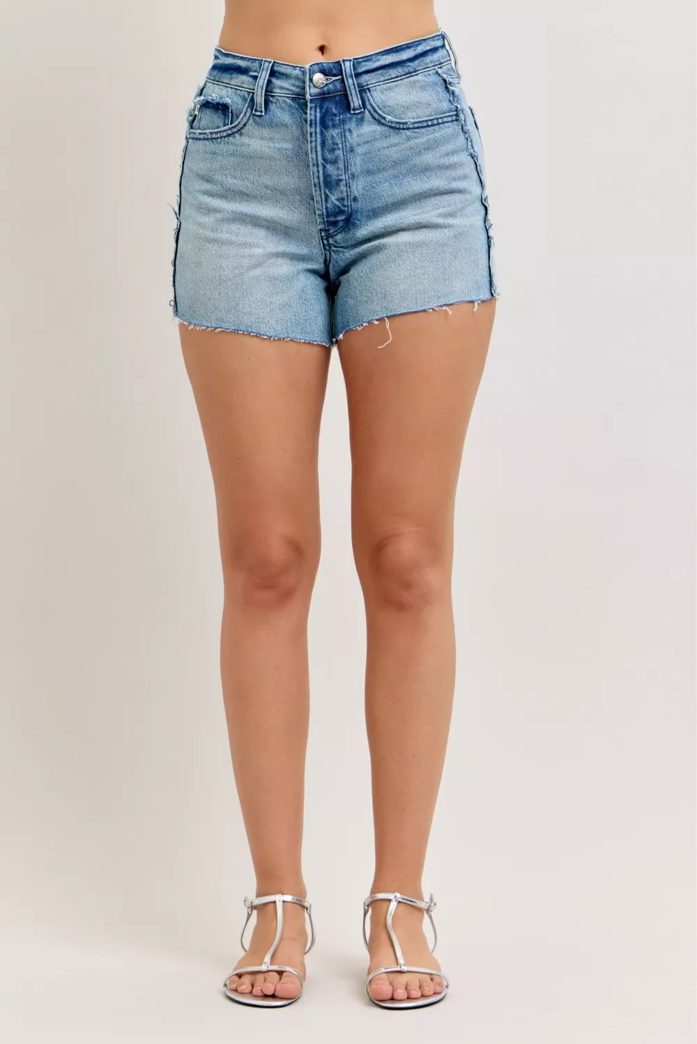 Judy Blue denim cut-off shorts with raw side seams and button closure