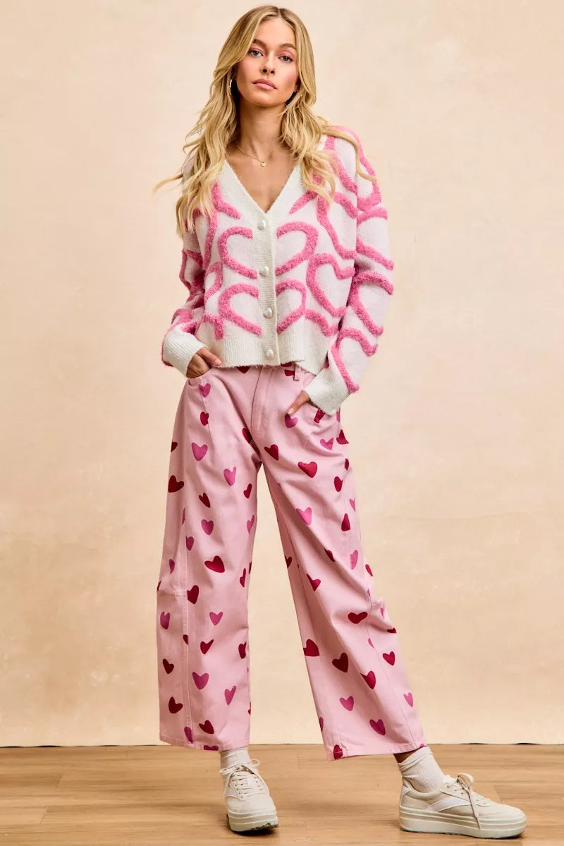 Pink and white textured heart cardigan with V-neck and button placket, long sleeves