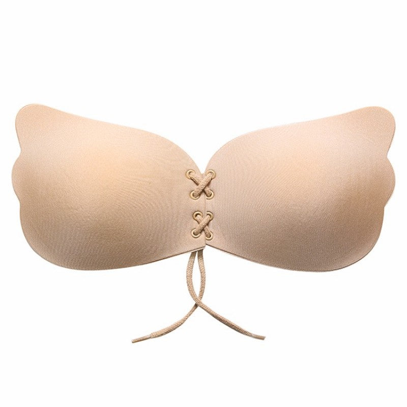 Strapless seamless bra, nude beige cups with lace-up center and dangling ties