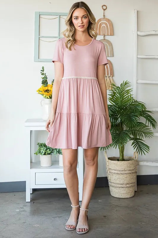 Dusty rose mini tiered dress with pompom lace waist trim, short sleeves, and flared skirt