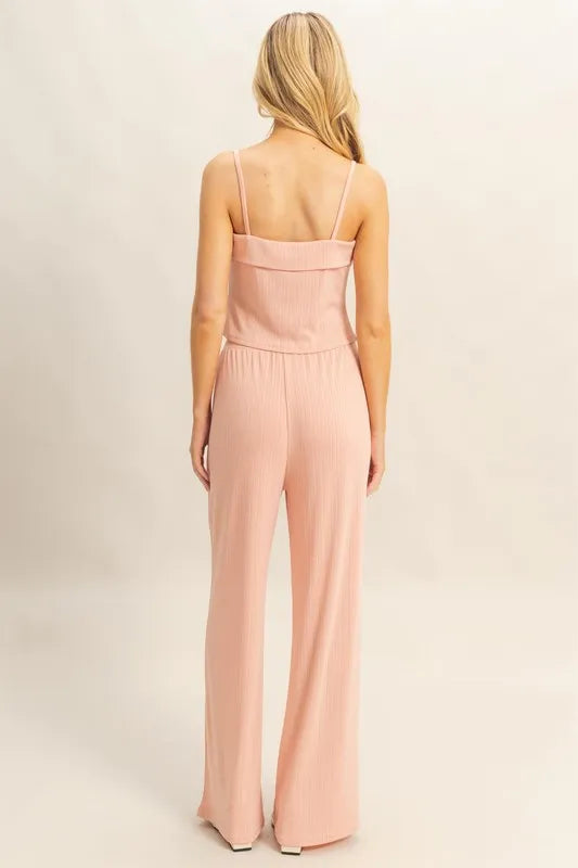 Back view: Peach rib-knit cami with scoop back and matching wide-leg pants