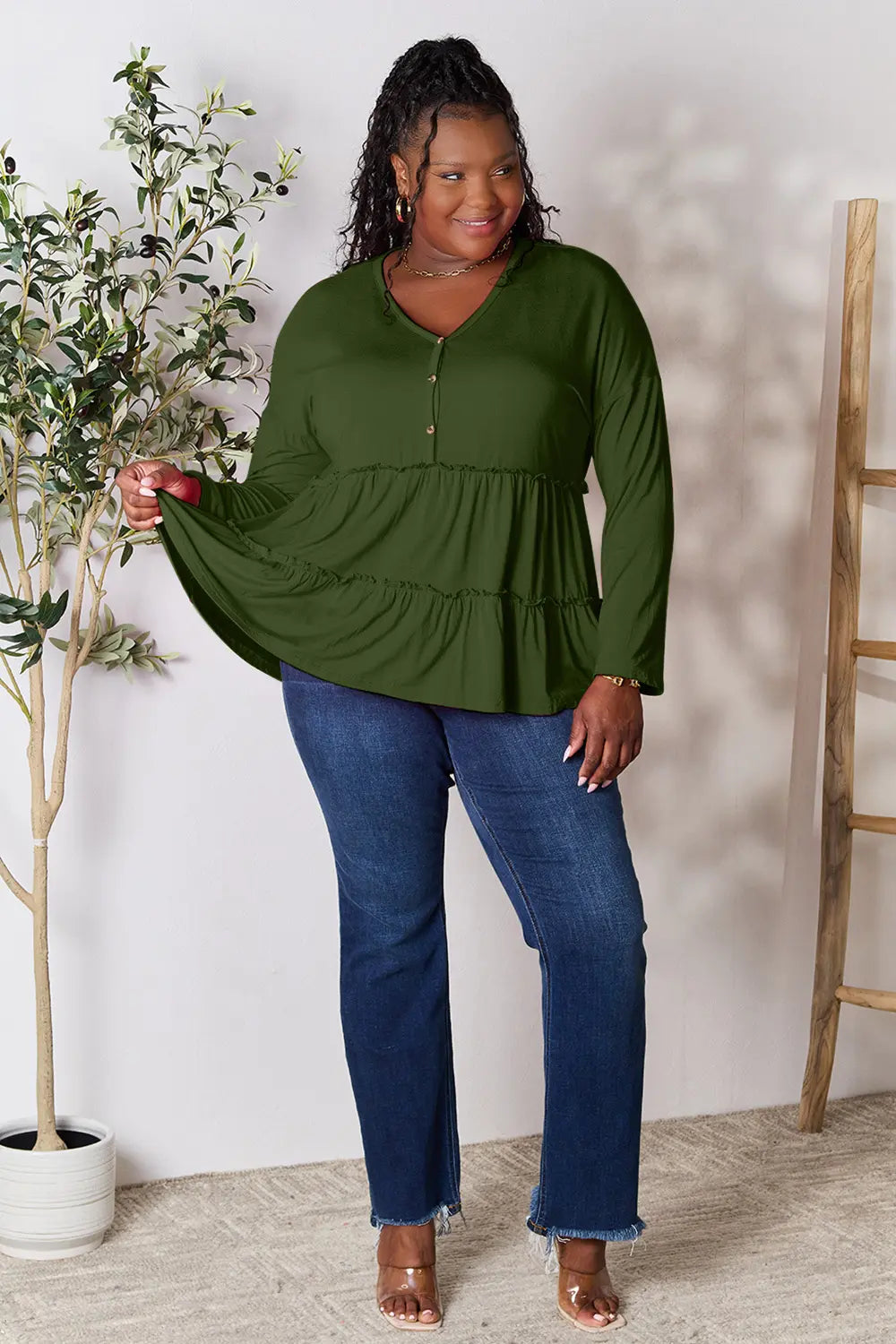 Army green long sleeve blouse with V-neck half-button front and ruffle tier hem