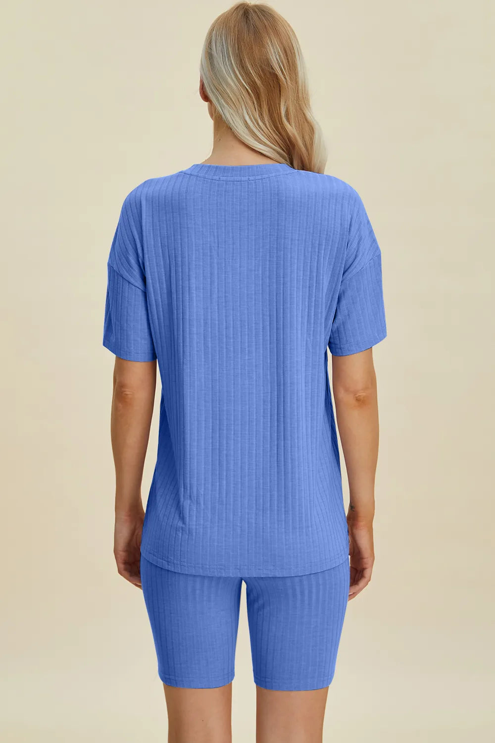 Blue ribbed V-neck short sleeve top and matching biker shorts set, back view