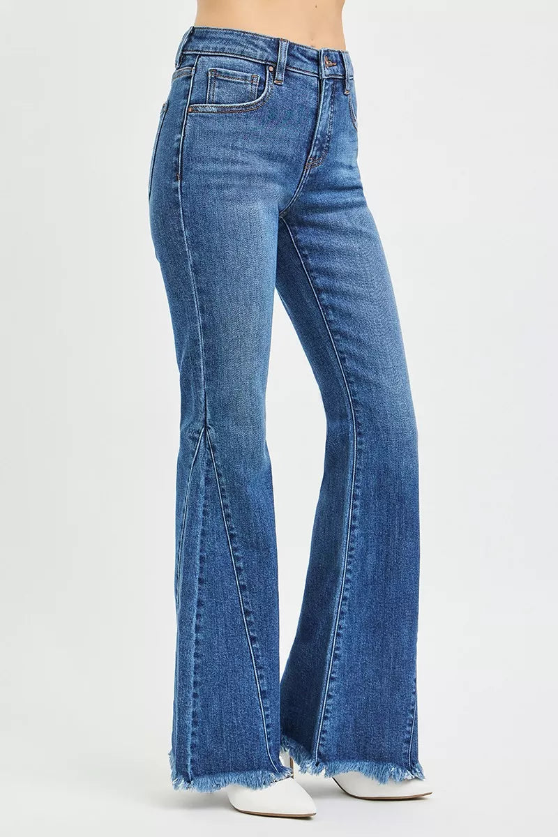 Back view mid-rise flare jeans in dark blue with back yoke seam and frayed hem
