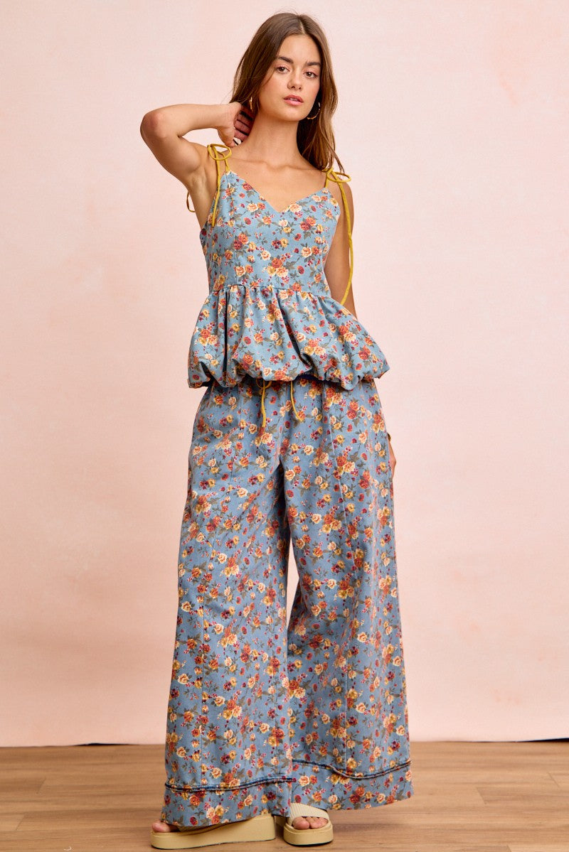 Denim-blue floral wide-leg pants with elastic waistband and drawstring tie, relaxed fit