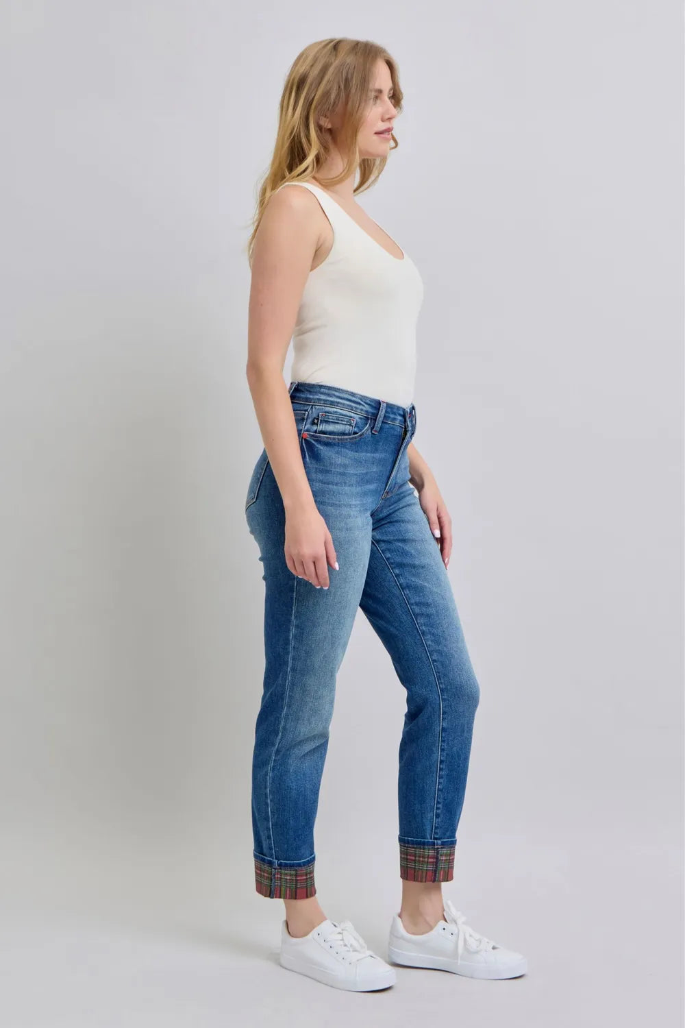Medium wash jeans with plaid cuffs, back waistband view from the side