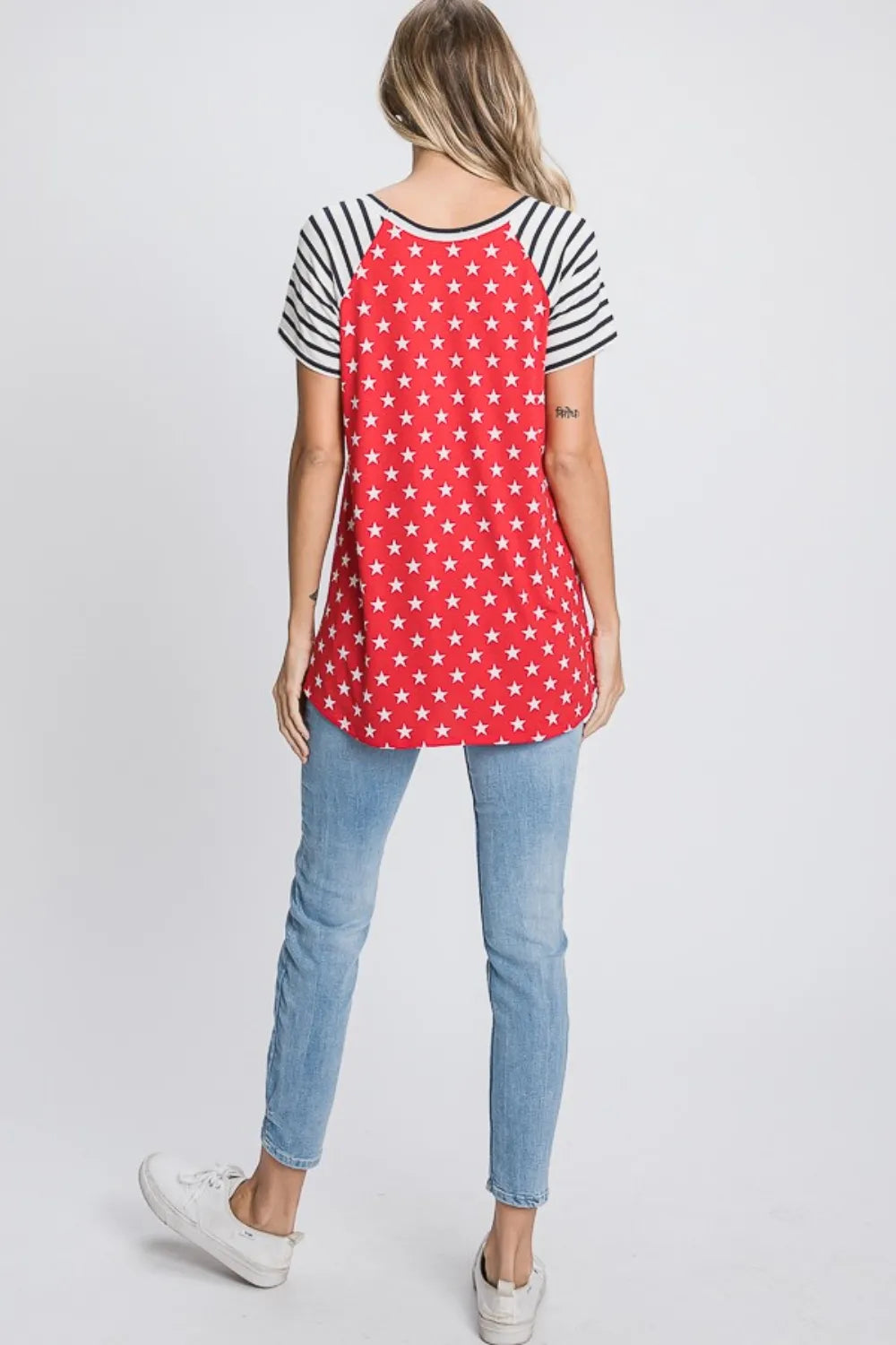 Back view of red star print plus-size T-shirt with navy striped raglan sleeves