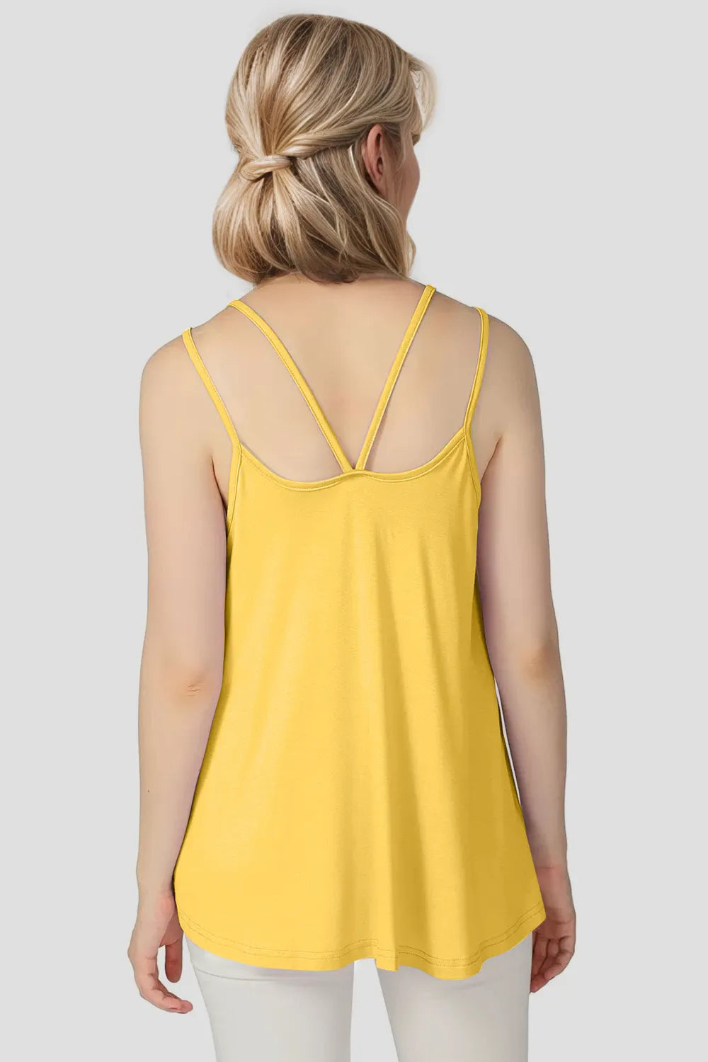 Light yellow cami with scoop neck and double spaghetti straps, racerback back view.