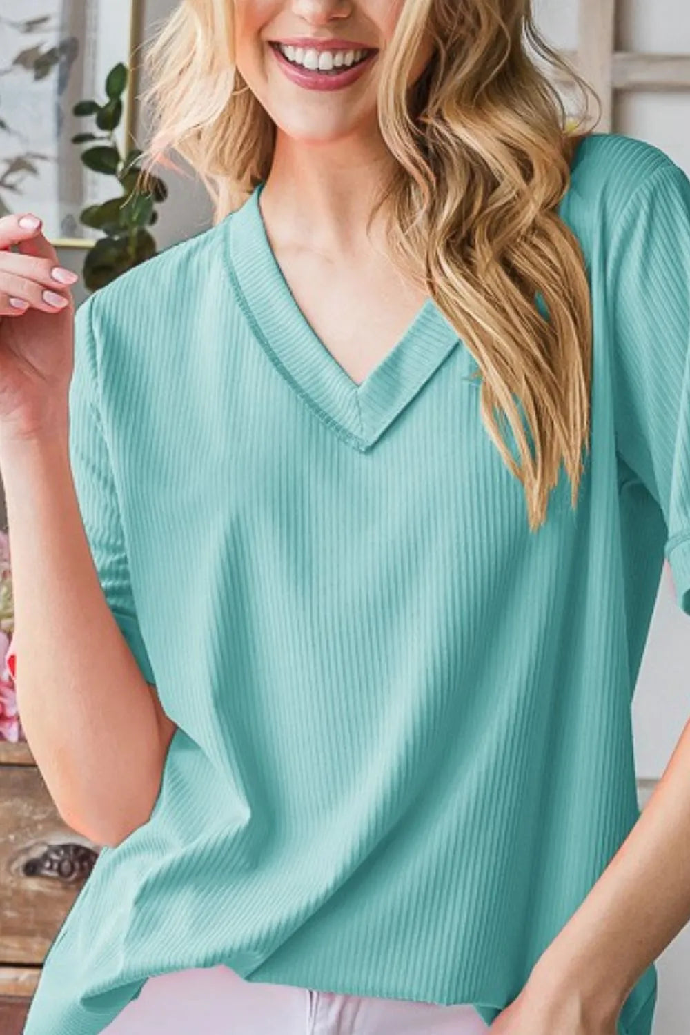 Mint blue V-neck half-sleeve tee with relaxed fit and ribbed fabric texture