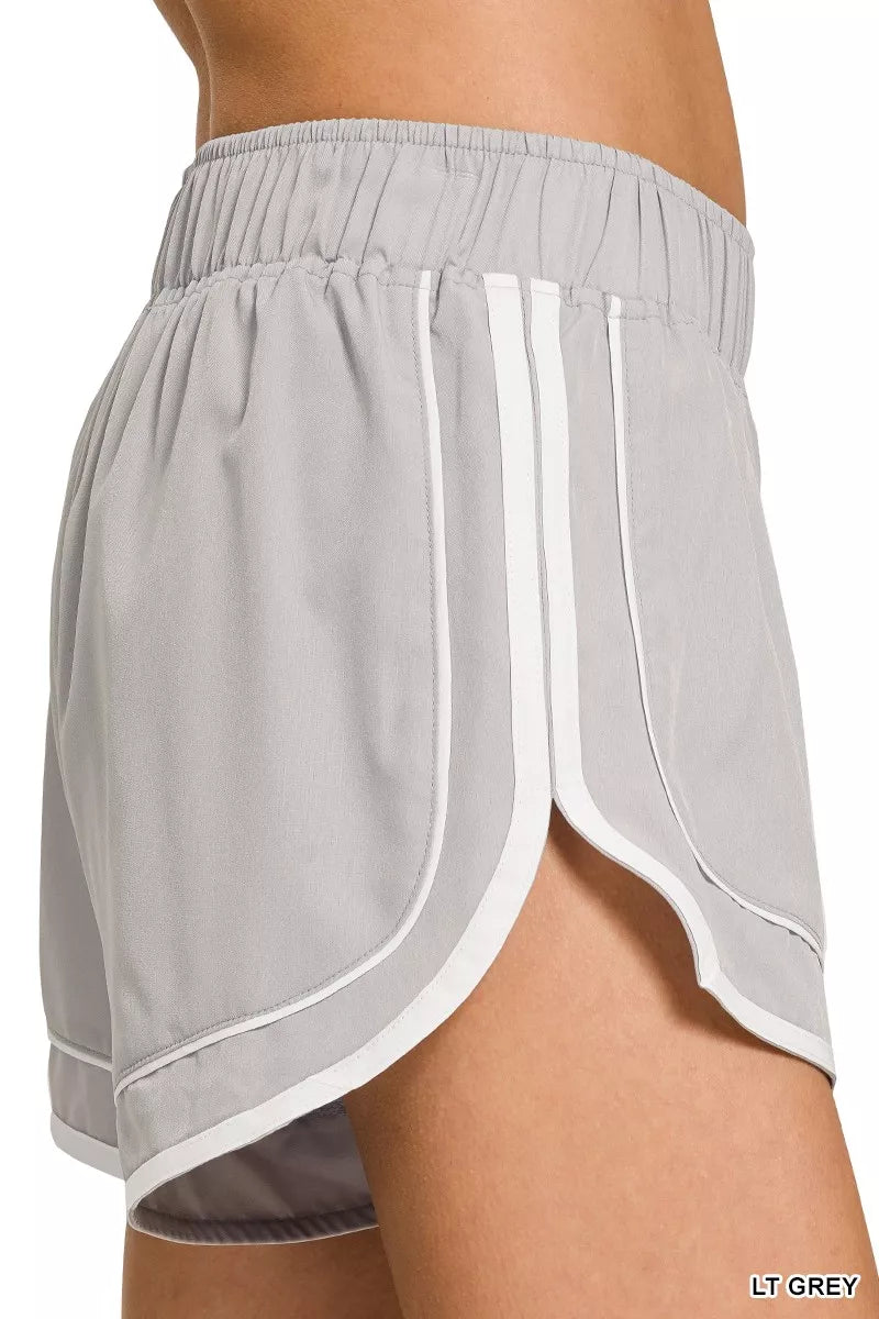 LT GREY lined dolphin shorts with elastic waistband and side seam detail, contrast trim