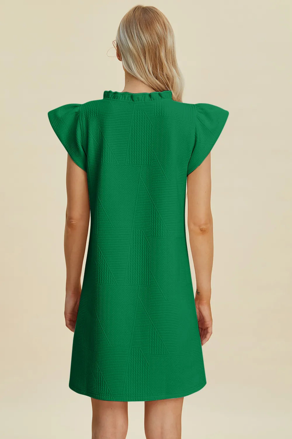 Ruffled V-neck cap sleeve dress, dark green, viewed from the back with gathered shoulders.