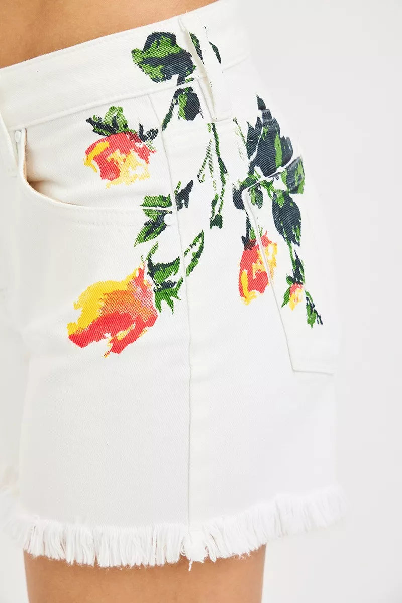 Close-up floral print on white high-rise shorts with button waistband