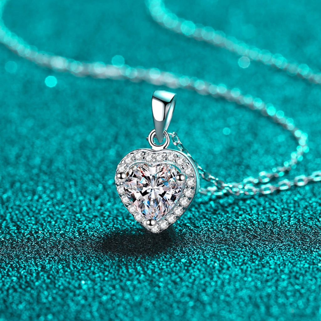 Heart moissanite pendant on silver chain, close-up of the clasp and bail