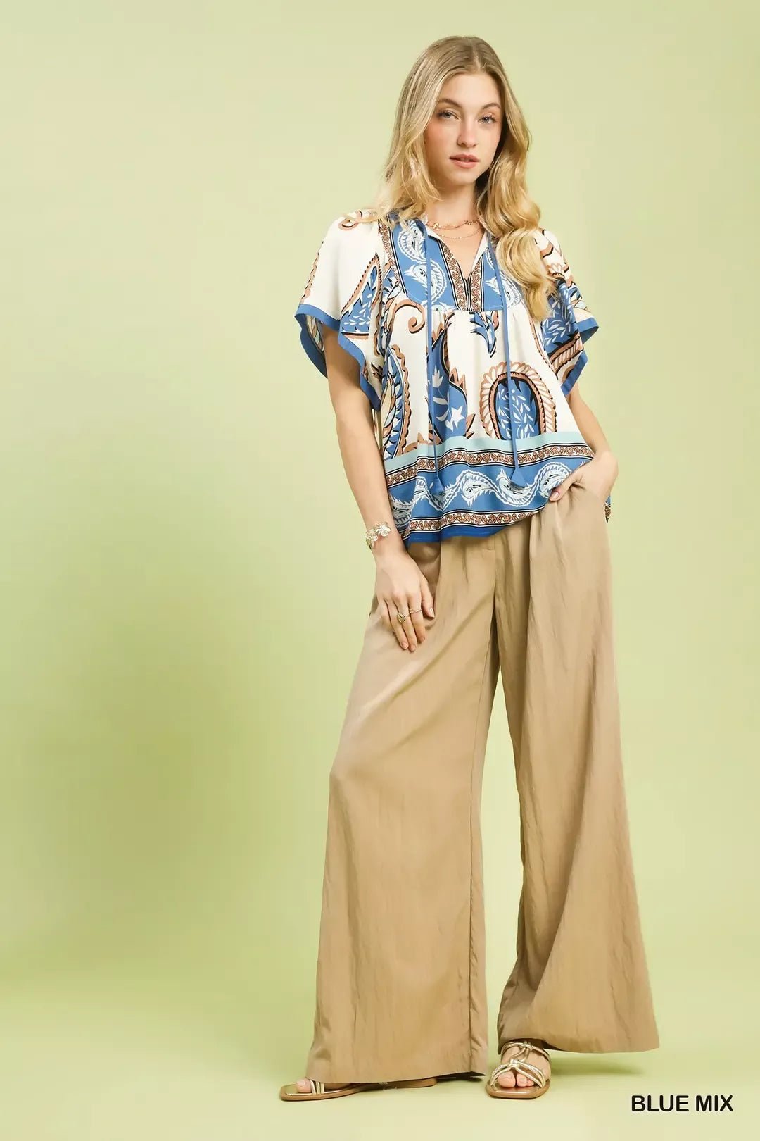 BLUE MIX paisley border print blouse with short sleeves, V-neck, and flowing silhouette