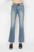 Light blue bootcut jeans, front close-up; button fly and stitched front pockets