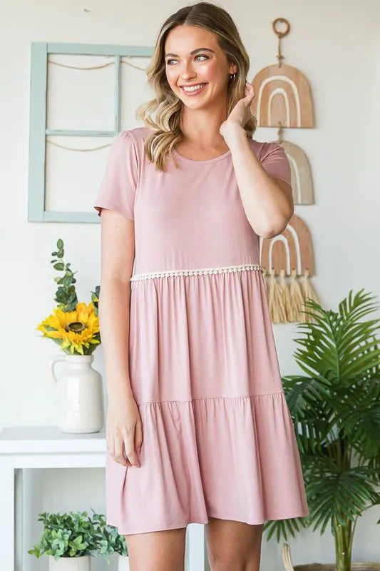 Dusty rose tiered babydoll mini dress with short sleeves and pompom lace waistband