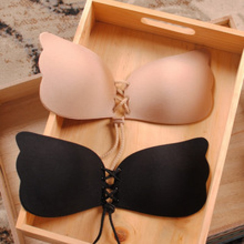 Strapless seamless bra, nude and black cups with lace-up center closure
