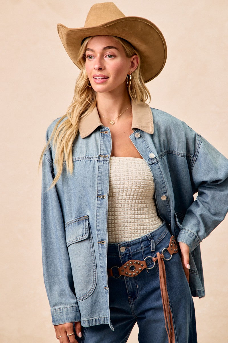 Washed denim jacket featuring contrast tan collar and flap chest pockets
