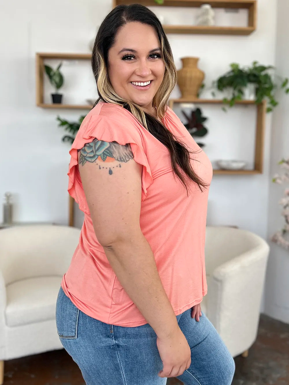 Coral pink t-shirt side view with flutter ruffle sleeves