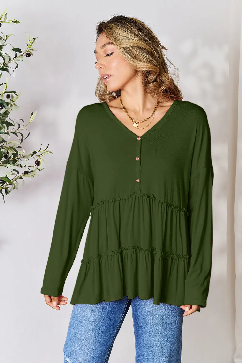 Army green long sleeve blouse with half-button front and tiered ruffle hem