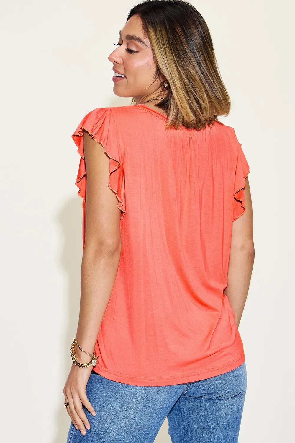 Coral ruffled-shoulder short-sleeve V-neck T-shirt, side view