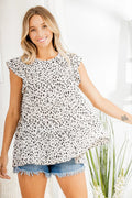 Ivory/black animal print blouse with round neck and tiered ruffle front