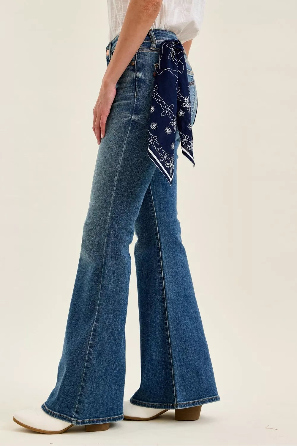 Judy Blue mid-rise flare jeans, back view, bandana loop with tucked scarf