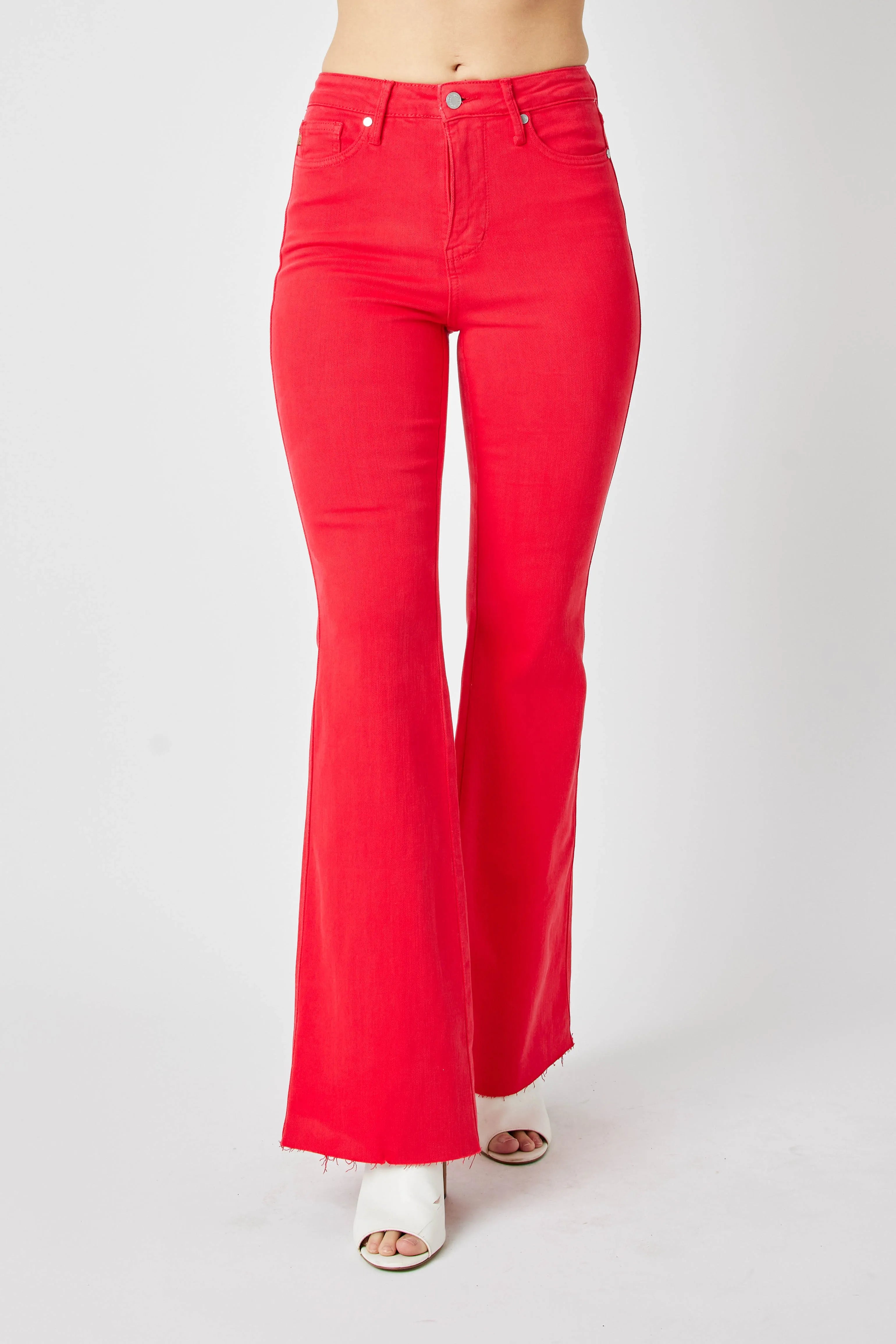 Red high-rise flare jeans with front button closure, belt loops, and open pockets