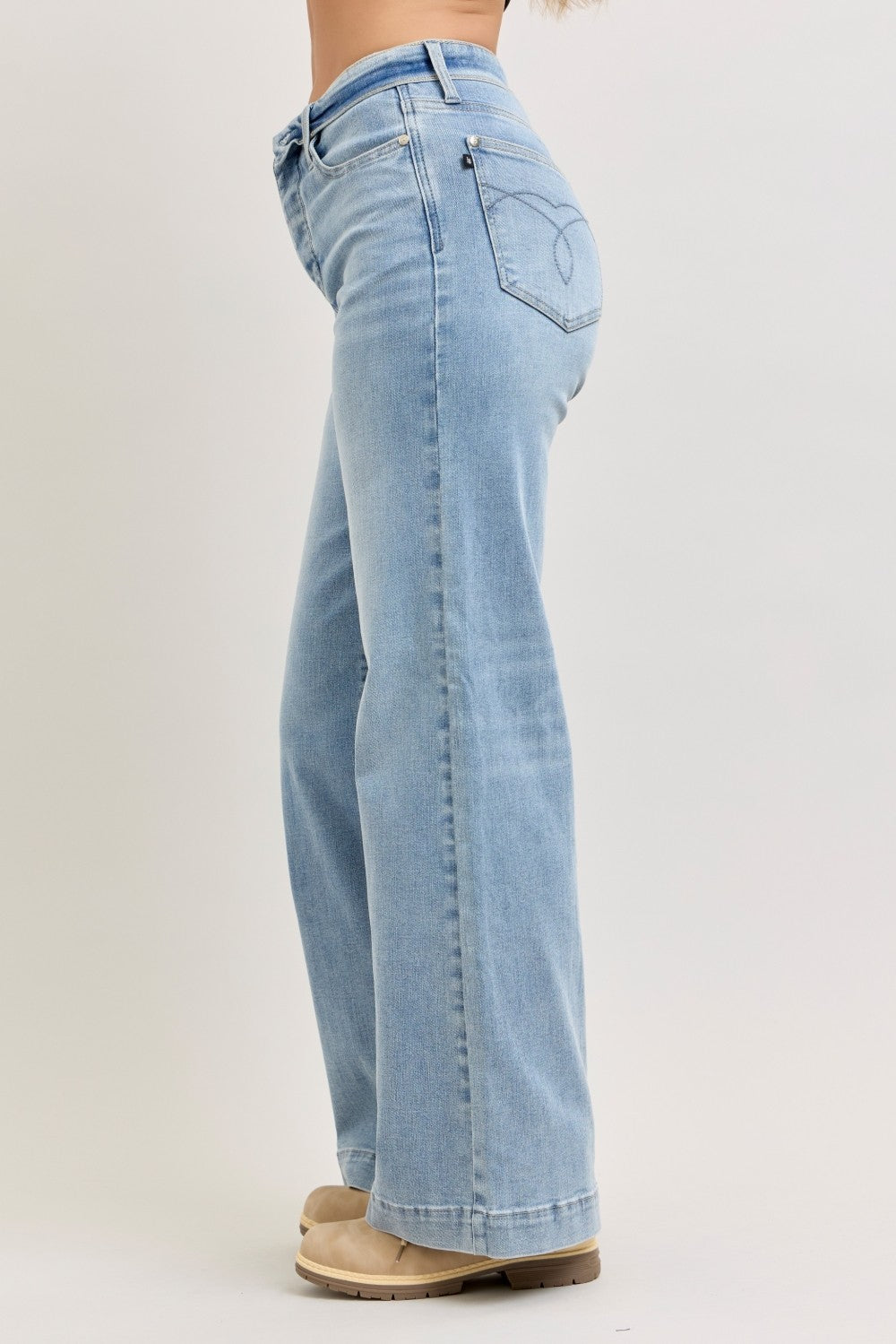 Light wash wide-leg jeans back view, mid-rise waist, back yoke and pockets