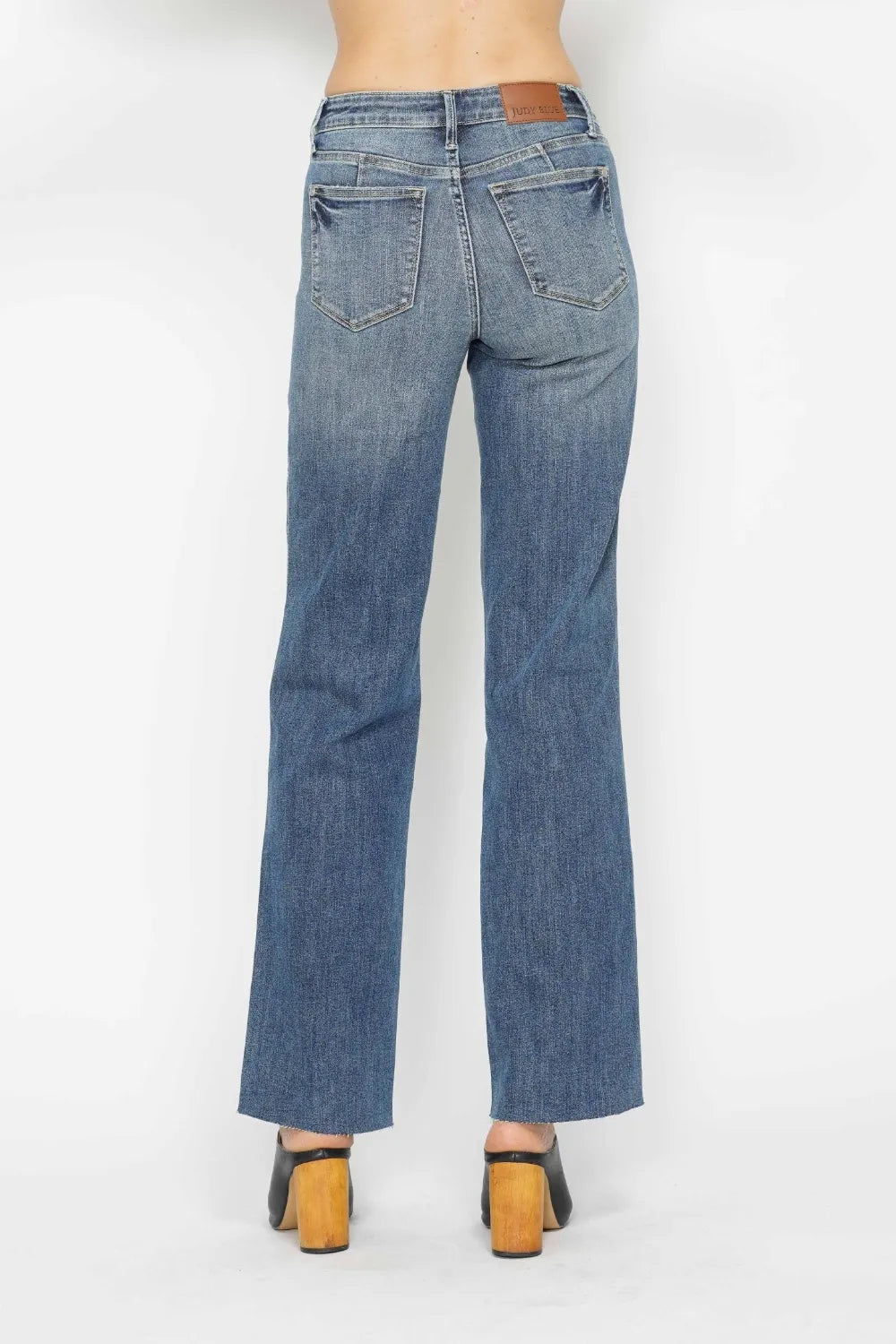 Back view medium wash straight jeans with 5-pocket design and button closure