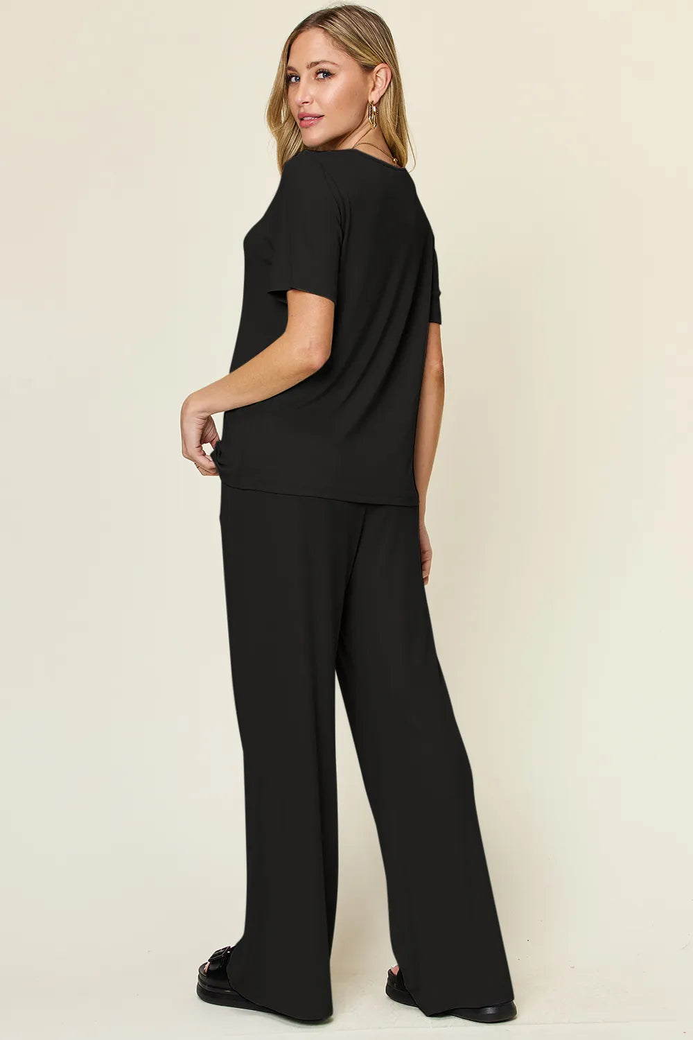 Black round-neck T-shirt and wide-leg pants set, back view