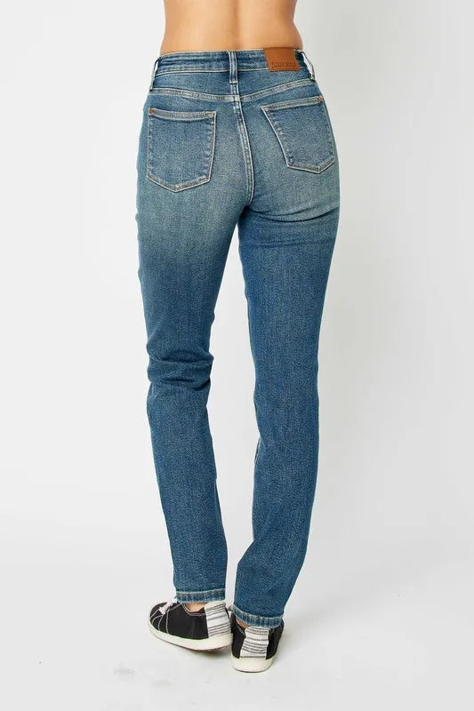 Dark high-waist skinny jeans with back patch pockets and contrast seam stitching