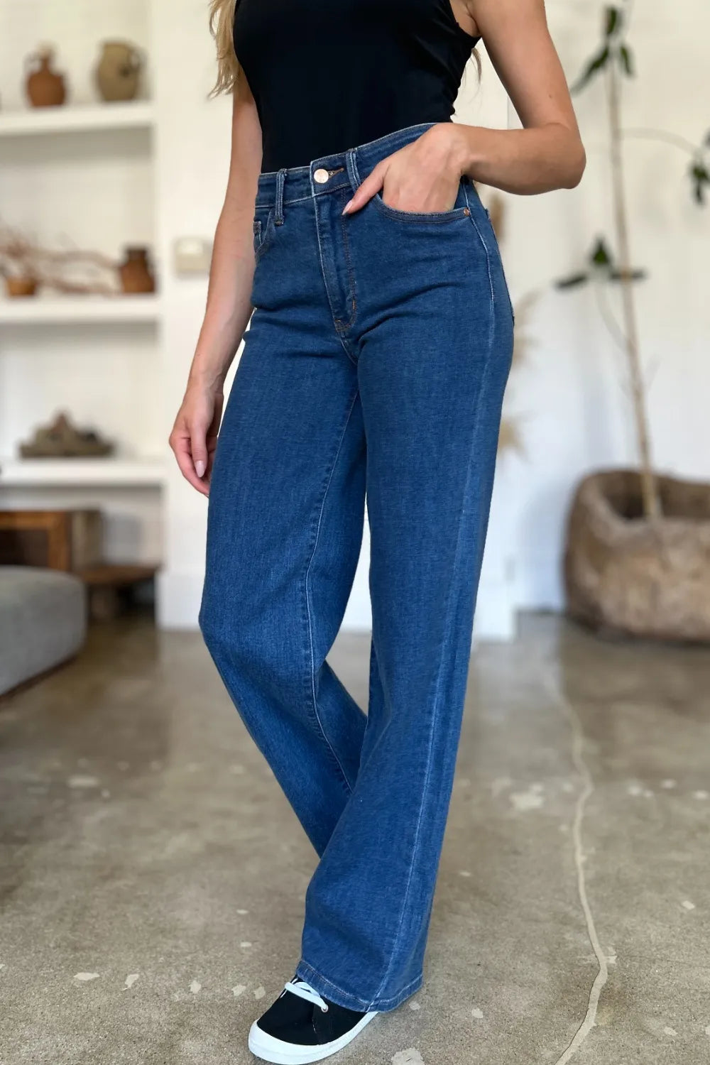 Medium blue high rise straight jeans with front pockets and straight tapered leg